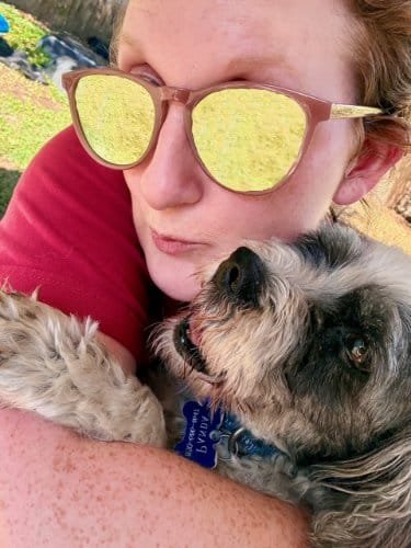 Dog and woman outdoor close-up, DFW Critter Sitter with woman and her pet dog in a sunny outdoor setting, highlighting pet care and companionship services offered by DFW Critter Sitter.